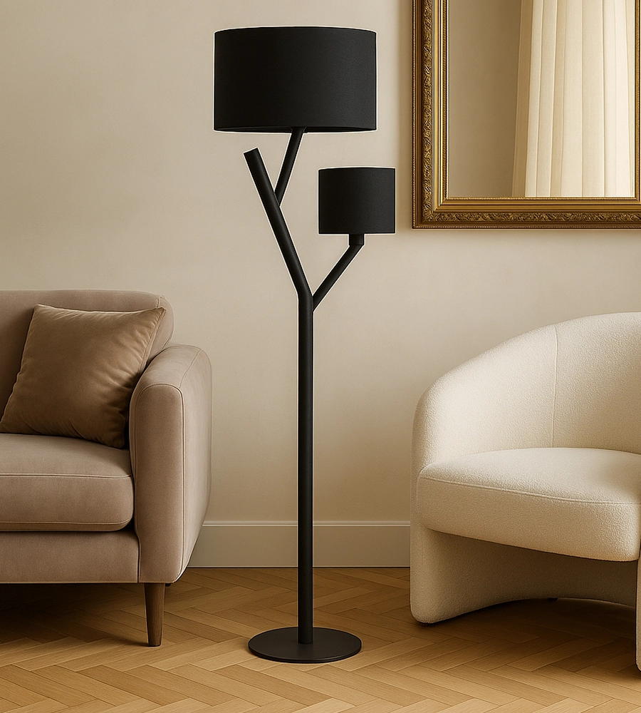 Black floor lamp on wooden floor near brown sofa