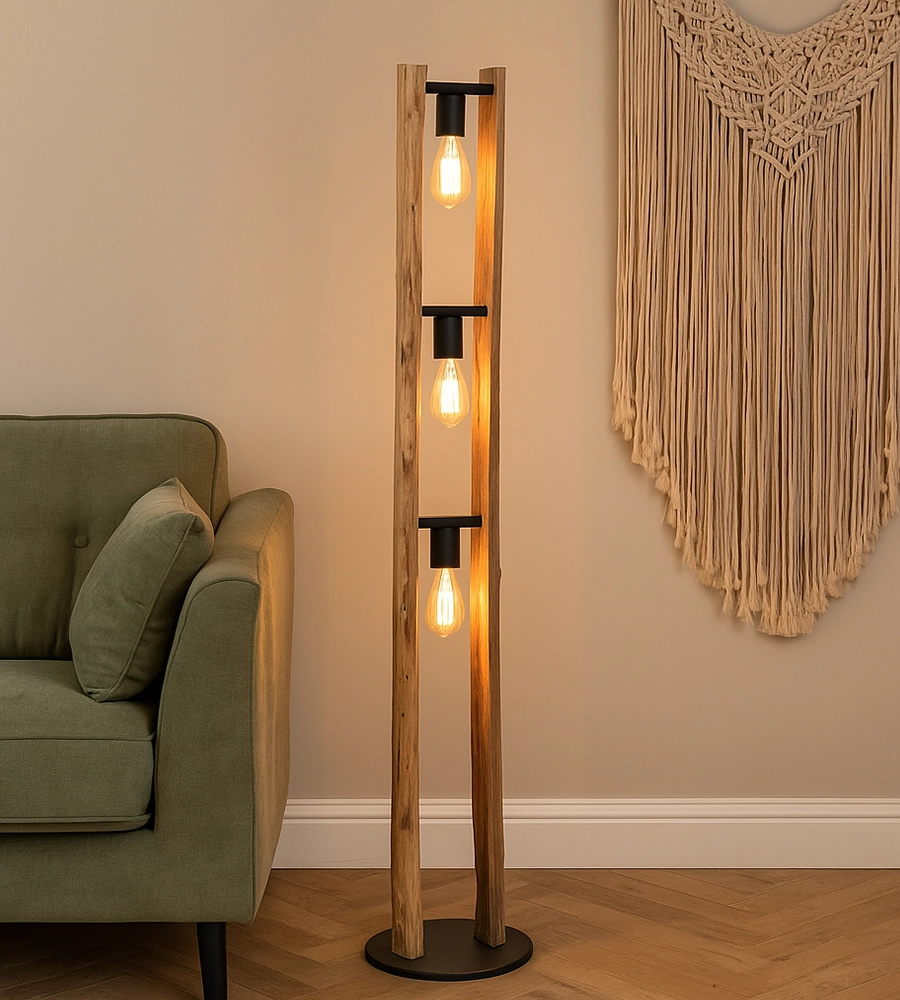 Wooden floor lamp at green sofa