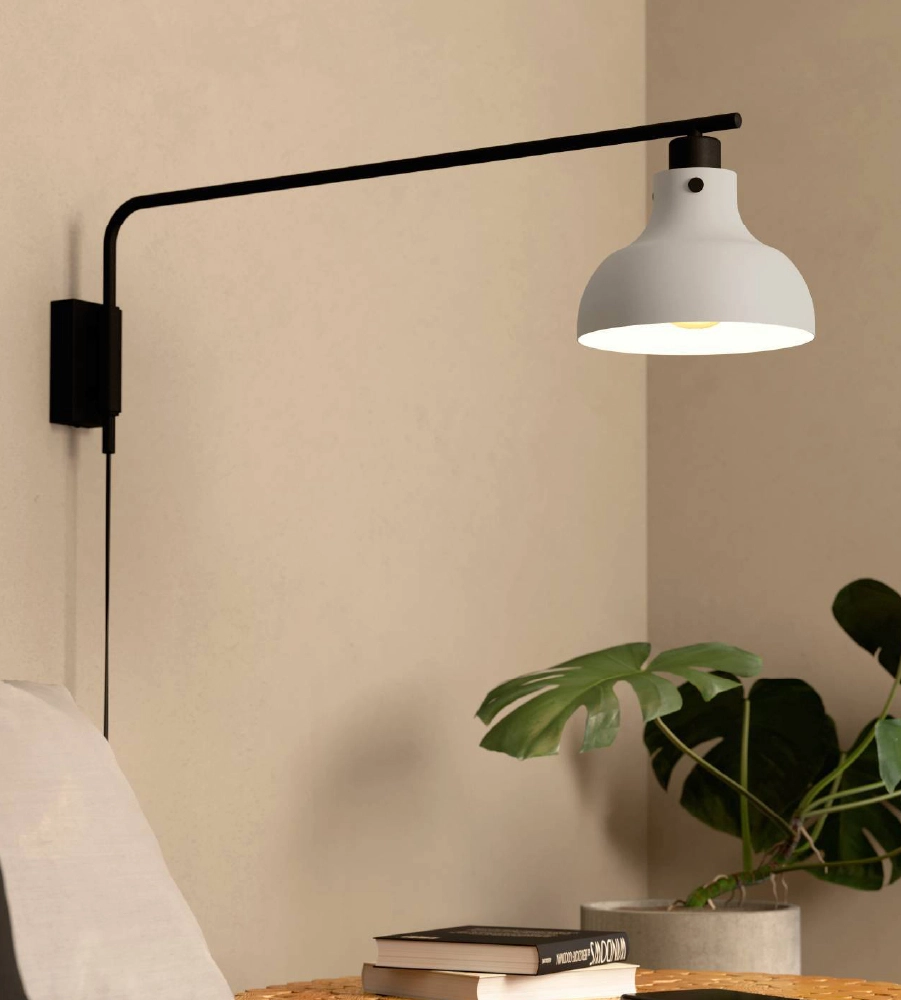 Black wall lamp with white shade in living room