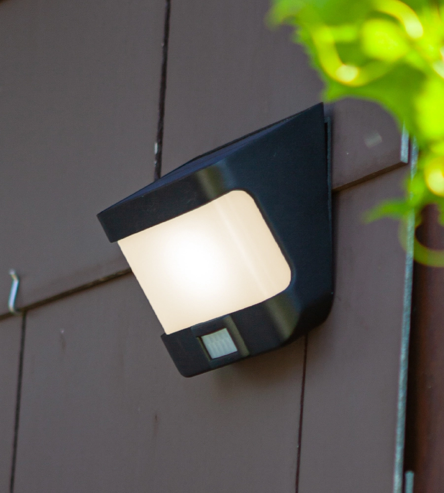 Solar wall lamp on façade cladding