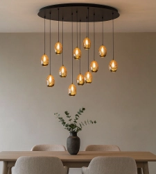 Highlight golden egg pendant lamp above dining table