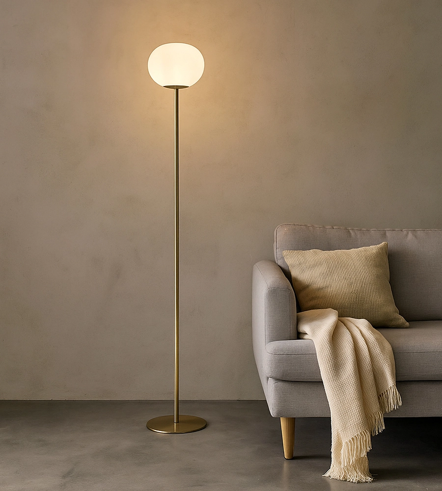 Golden floor lamp on concrete floor with bench